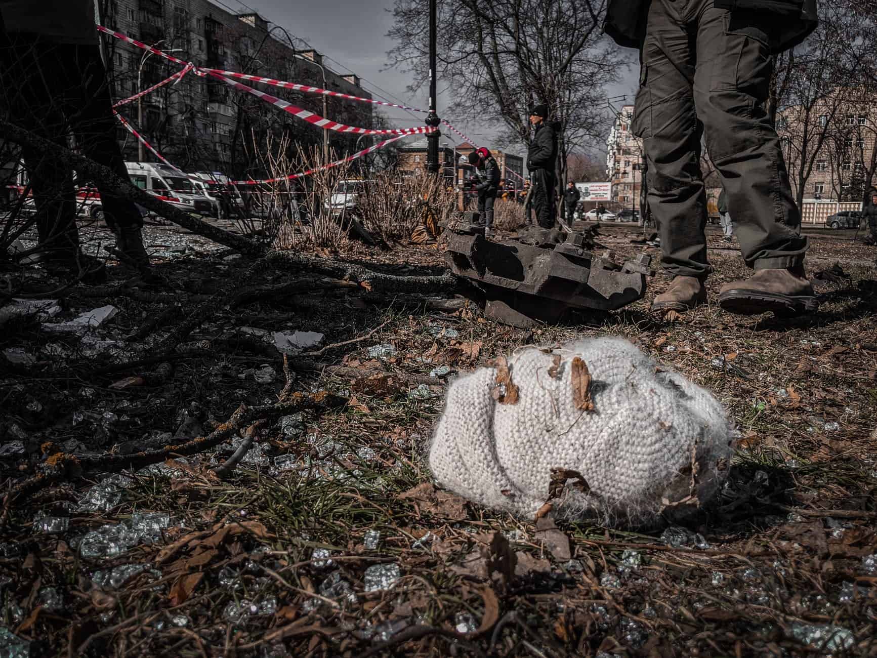 knitted hat lying among debris in ukrainian city