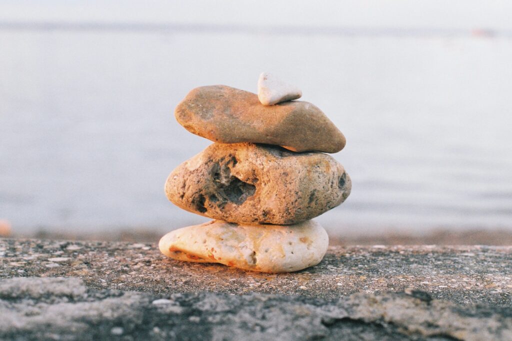 gray stone stack on gray sand